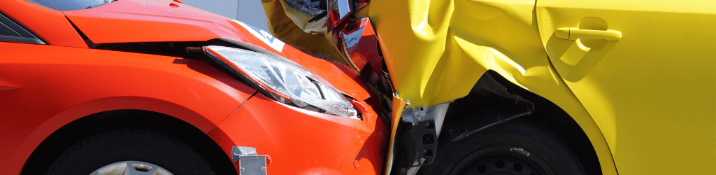 A red car and a yellow car in a car accident.