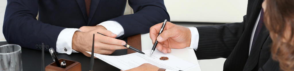 Lawyer going over documents with client.