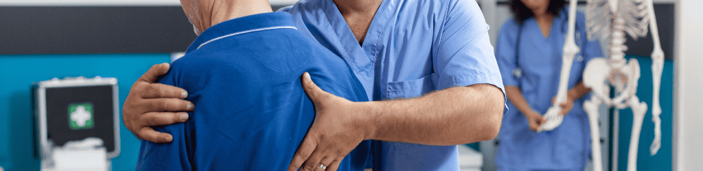 Orthopedic nurse stretching spinal cord and shoulder